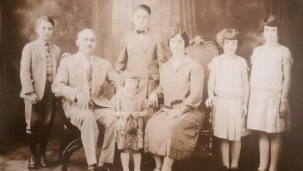 early 1900s sepia tone photo of Peter & Helen Watson with their 5 children